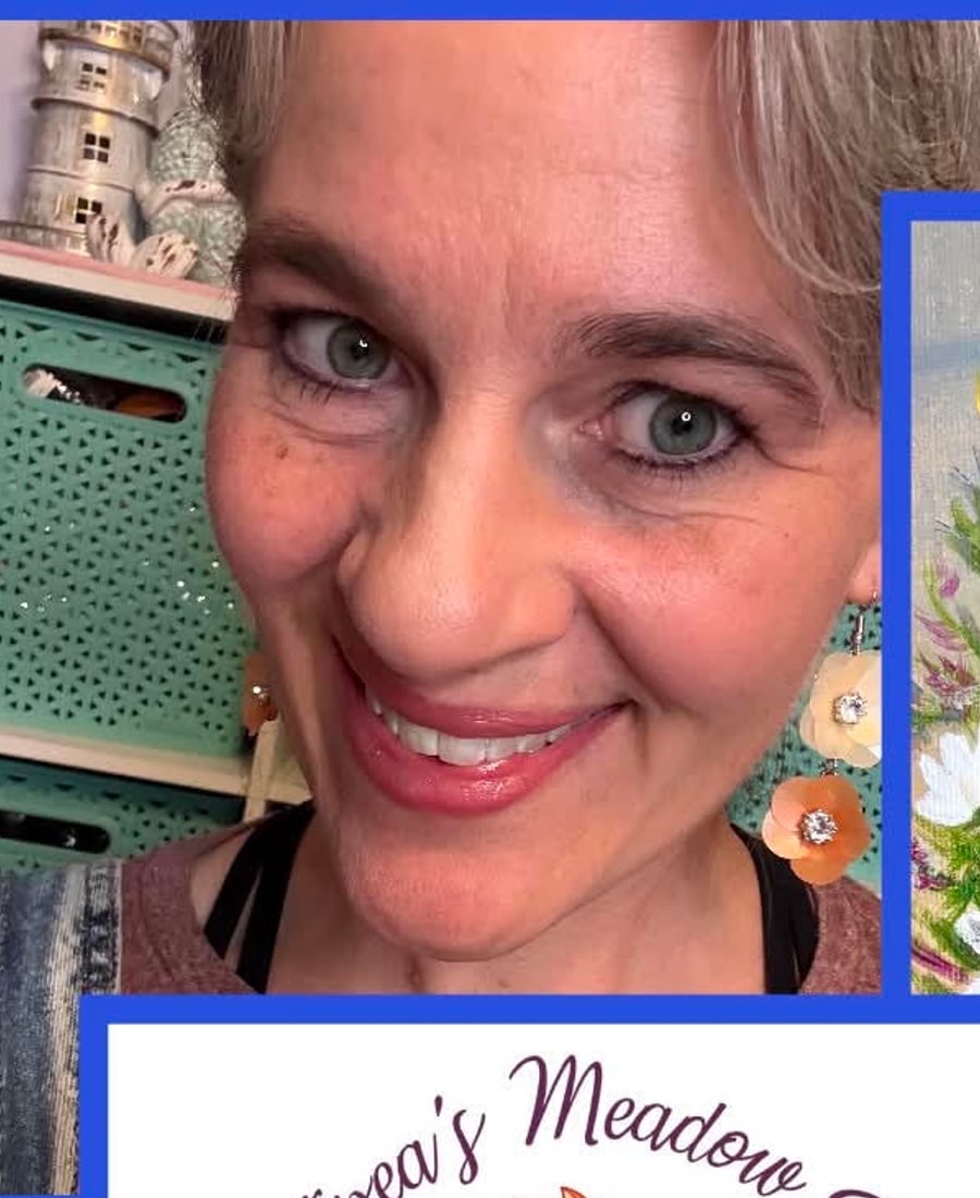 Emily, wearing a pair of her own flower earrings, in her studio