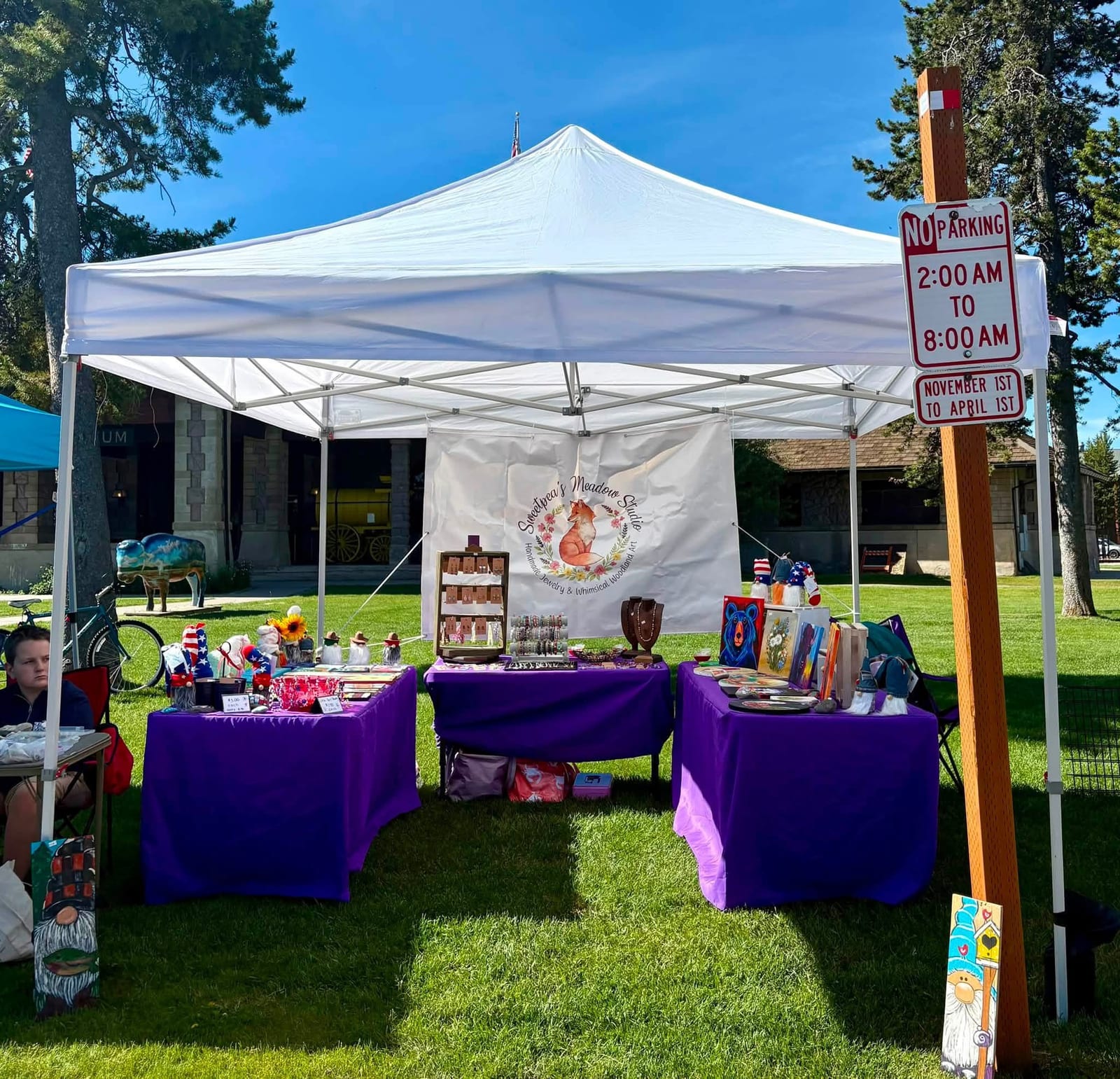 The Sweetpea's Meadow Studio booth set up on the grass at a summer market day